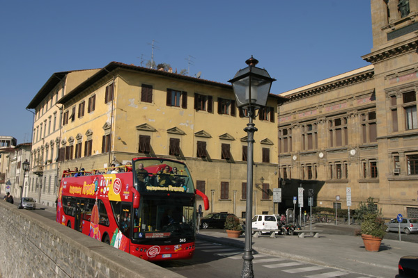 Tour of Florence (600Wx400H) - In spring and summer time it's cool to catch one of these buses and ride all around the city...
In this picture the bus is passing in front of the National Library of Florence (the second biggest of Italy). (Photo by Marco De La Pierre) 